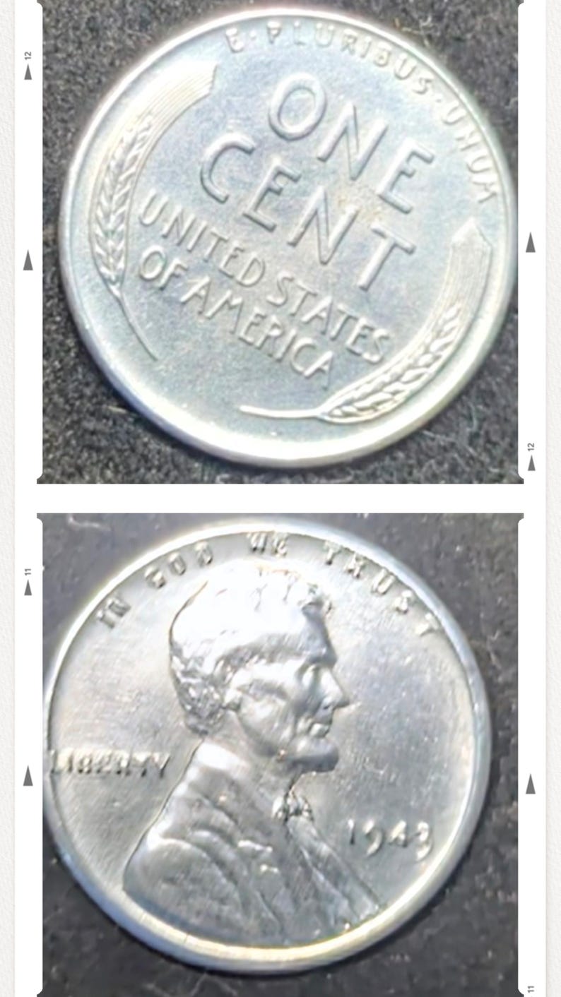 May include: Two silver United States one-cent coins. The first coin shows the words "ONE CENT" and "UNITED STATES OF AMERICA". The second coin features a profile of a man and the year 1943.