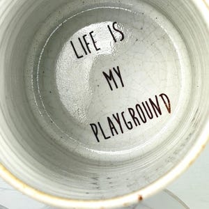 Rare CCLC Studio Pottery Mug - Life is My Playground Hidden Quote - Handcrafted Stoneware Coffee Cup with Swing Illustration and Ochre Base
