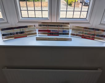 Soporte/colgador de pared para baquetas