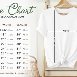 May include: Size chart for Bella Canvas 3001 t-shirts, showing measurements in inches and centimeters for sizes XS to 5XL. The chart includes width and length measurements.