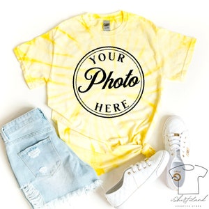 May include: Yellow tie-dye t-shirt with a black circle graphic that says "Your Photo Here".