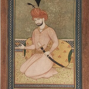 May include: An antique miniature painting of a man in traditional attire, seated on a patterned cushion. The figure wears a turban and holds a sword. The artwork is framed with a decorative border, showcasing intricate details and warm color tones.
