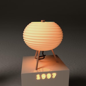 May include: A spherical, cream-colored lamp with a ribbed design, resting on a wooden tripod base. The lamp is illuminated, casting a warm glow. The base has the year "1997" lit up in a warm color.