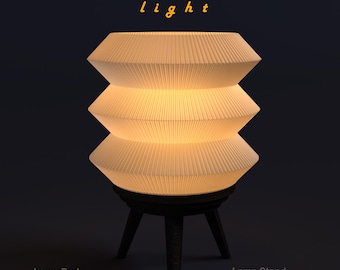 May include: A cream-colored, layered lamp with a pleated shade, resting on a dark, three-legged stand. The lamp has the text "1997 light" above it. The lamp body is 140mm x 120mm, and the stand is 110mm x 80mm.