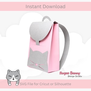 May include: A pink paper backpack with a grey cat face design. The backpack has a grey flap and straps. The text "Instant Download" is at the top, and "SVG File for Cricut or Silhouette" is at the bottom.
