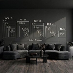 May include: A dark gray living room with a sectional sofa, coffee table, and wall art. The wall art displays size ratios and dimensions in inches and centimeters. The text on the wall reads "RATIO 2:3", "A1-A4", "RATIO 4:5", "RATIO 3:4", and "11x14". The text also reads "84 inches / 213 cm wide".