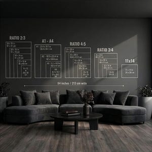 May include: A dark gray living room with a sectional sofa, coffee table, and wall art. The wall art displays size ratios and dimensions in inches and centimeters. The text on the wall reads "RATIO 2:3", "A1-A4", "RATIO 4:5", "RATIO 3:4", and "11x14". The text also reads "84 inches / 213 cm wide".