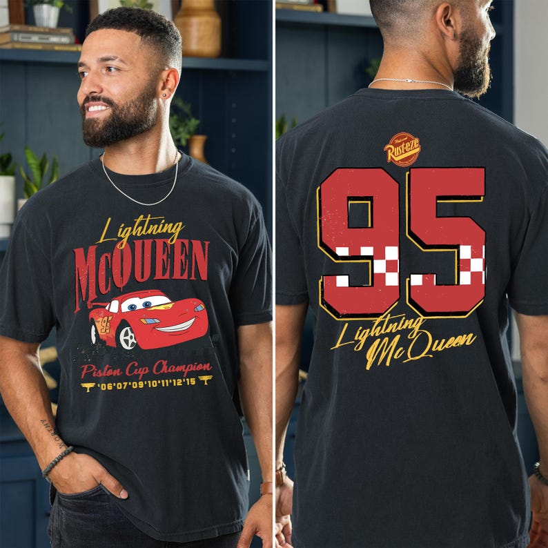 May include: Black t-shirt featuring Lightning McQueen graphics. The front displays "Lightning McQueen" with a red race car and "Piston Cup Champion." The back shows a large "95" and "Lightning McQueen" in gold.