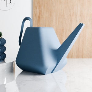 May include: A blue plastic watering can with a long spout. The watering can is sitting on a white marble surface.