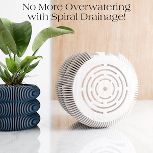 May include: A dark blue, layered planter with a plant and a white spiral drainage system. The planter has a unique design with horizontal lines. The text at the top says, "No More Overwatering with Spiral Drainage!"