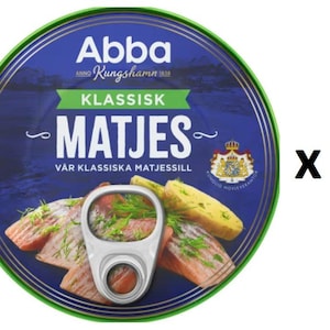 May include: A blue and green can of Abba Kungshamn Klassisk Matjes, a Swedish brand of herring. The can features a picture of herring fillets with dill and potatoes. The text on the can reads "Abba Kungshamn Klassisk Matjes Var Klassiska Matjessill". The can is labeled with a pack of 3.