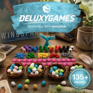 May include: A board game accessory set featuring four brown woven nests filled with assorted pastel-colored eggs, miniature birdhouses in various colors, small bird-shaped tokens, food tokens, and pink flower markers, totaling 135+ pieces.