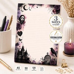 May include: A rectangular notepad with lined paper featuring a gothic design with a haunted house, a tombstone labelled 'IN MY HORROR ERA', a ghost mask, purple roses, a crescent moon, and a raven. Text includes '3 SIZES AVAILABLE', 'PERSONALISATION AVAILABLE', 'A5', '50 SHEETS', and '120 GSM SMOOTH PAPER'.
