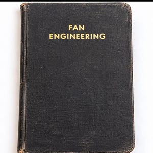 May include: A black hardcover book with the text FAN ENGINEERING printed in gold on the front cover. The book has a textured fabric-like finish on the cover with visible wear along the edges and spine, indicating a vintage or aged condition.
