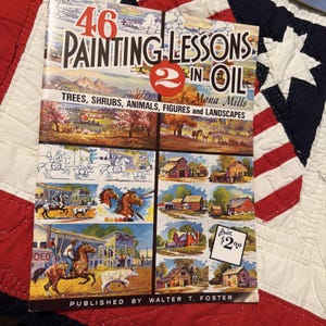 May include: A vintage book titled "46 Painting Lessons in Oil" by Mona Mills. The cover features colorful illustrations of trees, animals, figures, and landscapes. The book is published by Walter T. Foster and has a price tag of $2.00.