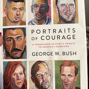 May include: A book titled "Portraits of Courage: A Commander in Chief's Tribute to America's Warriors" by George W. Bush. The cover features six portraits of people painted in a realistic style.