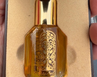 Fragancia árabe en aerosol: Oud cálido y ámbar (botella decorativa dorada)