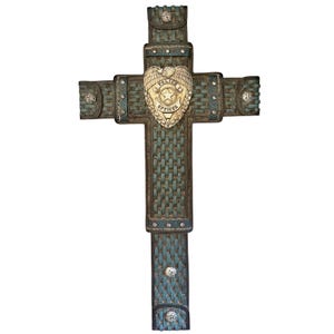 May include: A decorative cross with a woven teal and brown design. The center features a gold-colored police officer badge with a star and the words "Police Officer". Embellished with silver-colored studs and decorative accents.