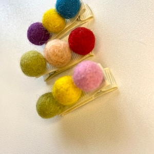Set of 3 hair clips with small cute handmade wool pom poms and an alligator clip for strong hold of fine hair of baby girl or toddler