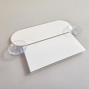 May include: White rectangular sign with rounded corners and two clear suction cups. The sign is blank and ready for personalization.