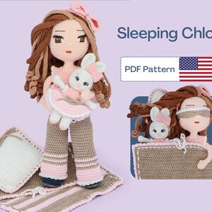 May include: A crocheted doll called Chloe, with brown hair and a pink dress, is holding a crocheted bunny. Chloe is wearing a sleep mask and lying on a brown and pink striped blanket with a white pillow. The image includes the text "Sleeping Chloe" and "PDF Pattern".