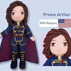 May include: Crochet pattern for a Prince Arthur doll. The doll is wearing a blue and gold uniform with a burgundy cape. The pattern is available as a PDF download.