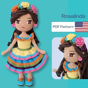 May include: A crocheted doll named Rosalinda, wearing a yellow dress with a colorful skirt and a floral crown. The doll has brown hair and is wearing blue shoes. The image includes the text "Rosalinda" and "PDF Pattern".
