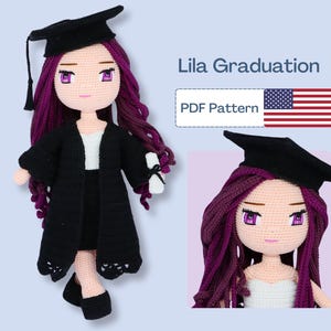 May include: Lila Graduation PDF Pattern crochet doll amigurumi pattern. The doll is wearing a black graduation gown and cap, a white shirt, and a black skirt. She has long purple hair and purple eyes. The doll is holding a diploma in her right hand.