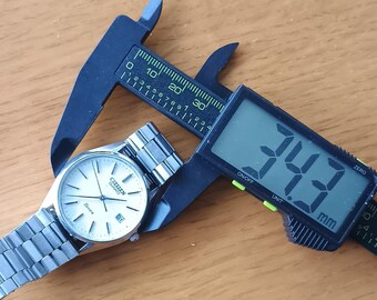 ヴィンテージ90年代シチズンクォーツ腕時計：ミニマルなステンレス