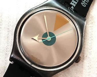 Reloj Swatch Gent vintage con esfera gráfica, cuarzo suizo funcional, estilo arte callejero de los 90