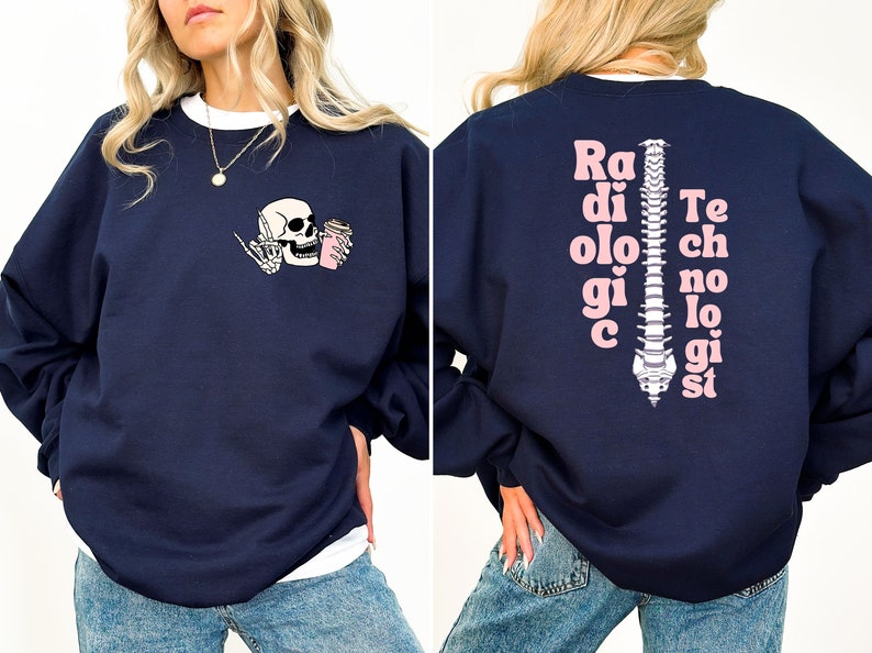 May include: Navy blue sweatshirt with a pink skull and coffee cup graphic on the front and the text "Radiologic Technologist" with a pink spine graphic on the back.