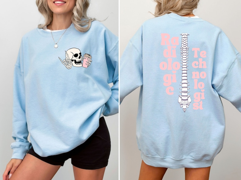 May include: Light blue sweatshirt with a skeleton drinking coffee on the front and the text "Radiologic Technologist" with a spine graphic on the back.