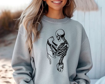 Sudadera con capucha unisex Comfort Colors con diseño de gato esqueleto, ideal para Halloween.