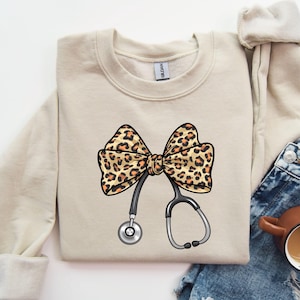 Leopard Stethoscope Sweatshirt, Coquette Bow Nurse Sweatshirt, Nurse Stethoscope Sweatshirt, Gift For Nurse, Leopard Bow Sweatshirt