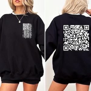 May include: Black sweatshirt with a white QR code printed on the back and a white QR code with an American flag design printed on the front.