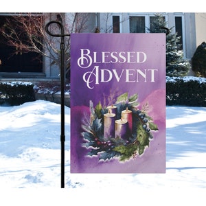 May include: Purple and white garden flag with the text "Blessed Advent" and a wreath with four purple candles.