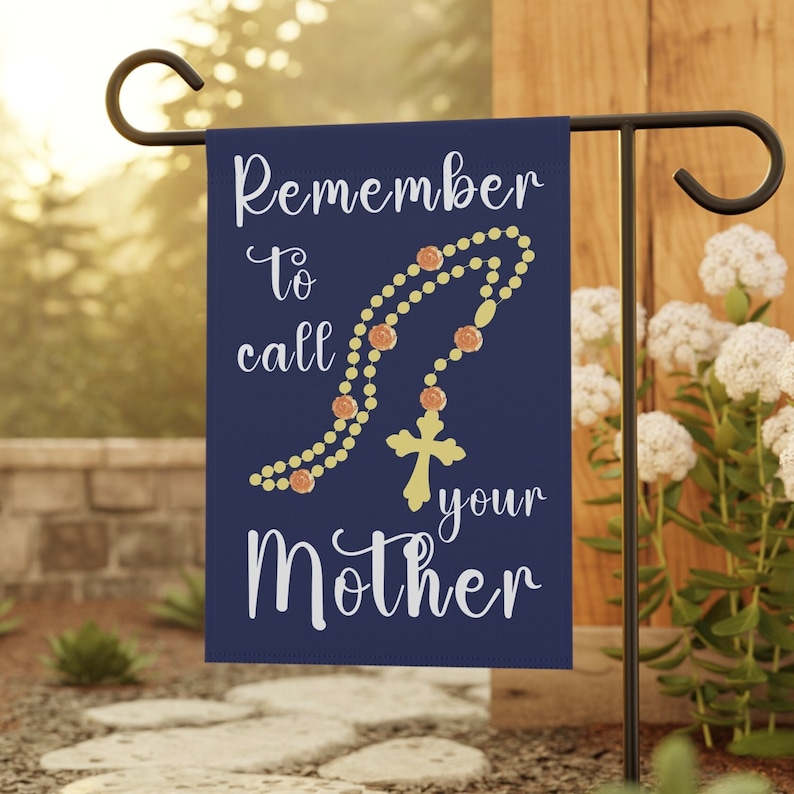 May include: A blue garden flag with a white rosary and the text "Remember to call your Mother".