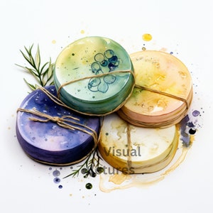 May include: Four round, watercolor-style coasters in shades of blue, green, and yellow, tied with twine. The coasters have a textured appearance and are decorated with subtle floral designs. Sprigs of greenery are placed around the coasters.