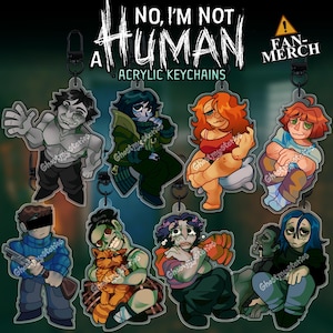 Op de afbeelding: Acryl sleutelhangers met gestileerde illustraties van verschillende personages met een griezelig thema. De sleutelhangers hebben een zwarte metalen sluiting en de tekst "NO, I'M NOT HUMAN" en "FAN-MERCH". Elk personage heeft een uniek ontwerp en kleurenpalet.
