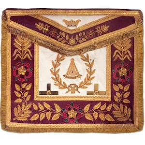 May include: A maroon Masonic apron with gold embroidery. The apron features a gold crown, a wreath of leaves, a compass and square, and a rose design.