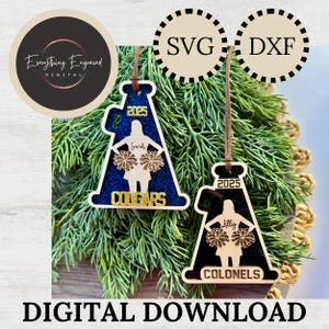 May include: Two wooden cheerleader ornaments with glitter accents. One is blue with "Cougars" and the other is black with "Colonels". Both have the year "2025" and a cheerleader figure. The image also includes the text "DIGITAL DOWNLOAD".