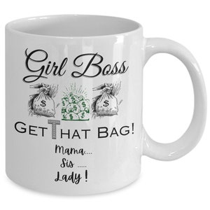 May include: White ceramic mug with a black and green design. The mug features the text "Girl Boss" and "Get That Bag!" with the word "That" in green. Below the text is the phrase "Mama... Sis... Lady!"