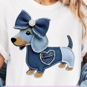 May include: White t-shirt featuring a denim dachshund design with a bow and heart detail. The design includes the text "Digital Design Only" and "8 FREE Designs Included". The shirt is worn by a person.
