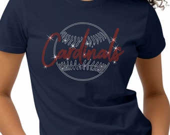 May include: A navy blue t-shirt with a red rhinestone baseball design and the word "Cardinals" in red rhinestones.