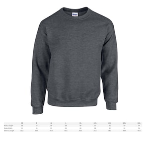 May include: A dark heather gray crewneck sweatshirt. The image shows the front of the sweatshirt, with a ribbed collar, cuffs, and hem. Size chart with body length, width, and sleeve length measurements in inches is below the sweatshirt.