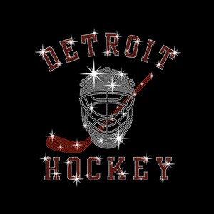 May include: Black graphic with the word "DETROIT" arched above a hockey goalie mask and hockey stick. The word "HOCKEY" is below the mask. All text and the mask are made of white and red rhinestones.