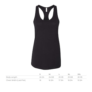 May include: A solid black racerback tank top with a scoop neckline. Below the garment, a size chart displays body length and chest width measurements in inches for sizes S through 2XL, ranging from 24 1/4 to 26 1/8 inches in length.