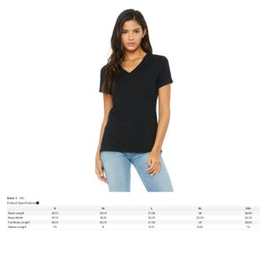 May include: A black V-neck t-shirt. The shirt is being modeled by a person wearing blue jeans. The product specifications table shows the body length, body width, full body length, and sleeve length measurements for sizes S-3XL.