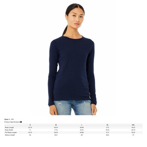 May include: A navy blue long-sleeve shirt. The shirt is a solid color and has a crew neck. The image also includes a size chart with measurements in inches for sizes S-2XL.