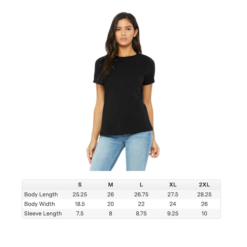 May include: A black short-sleeve t-shirt. The image includes a size chart with measurements in inches for body length, body width, and sleeve length for sizes S, M, L, XL, and 2XL. The model is wearing blue jeans.